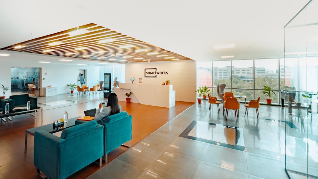Modern open-plan media company office interior with natural light