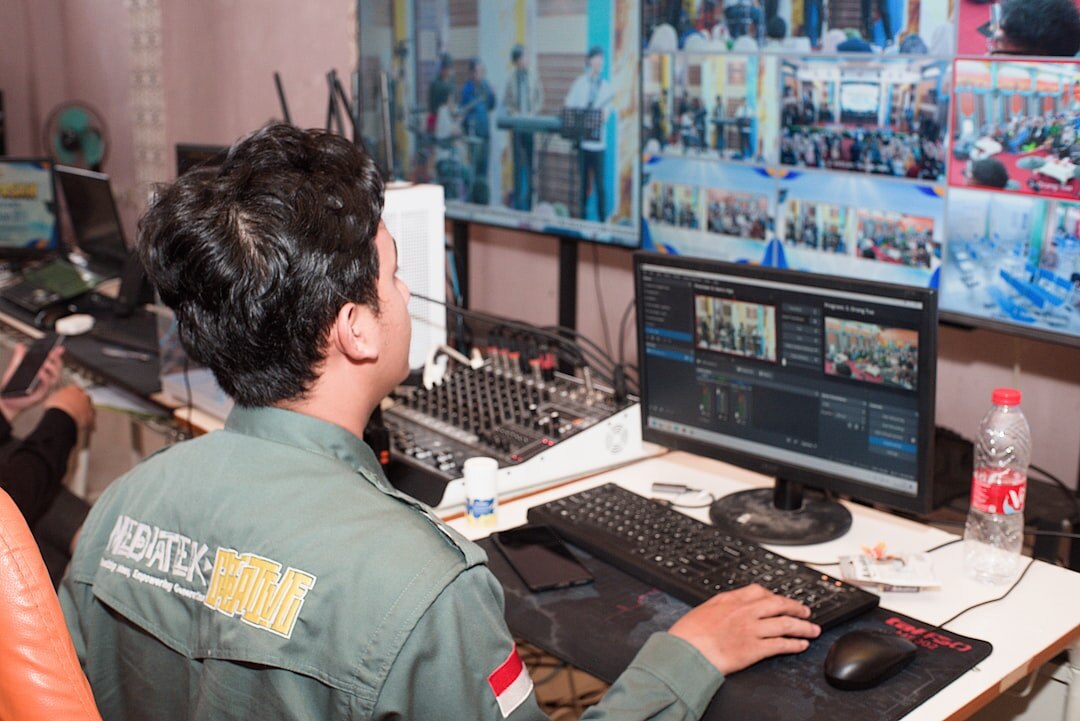 Wall of monitors in a broadcast control room showing live news feeds